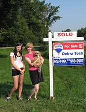 Blaze helps Anne and Robin put up the Sold Sign!